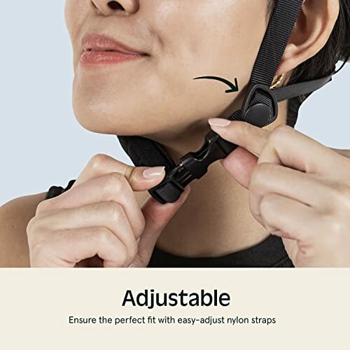 Person adjusting helmet strap with easy-adjust nylon straps.