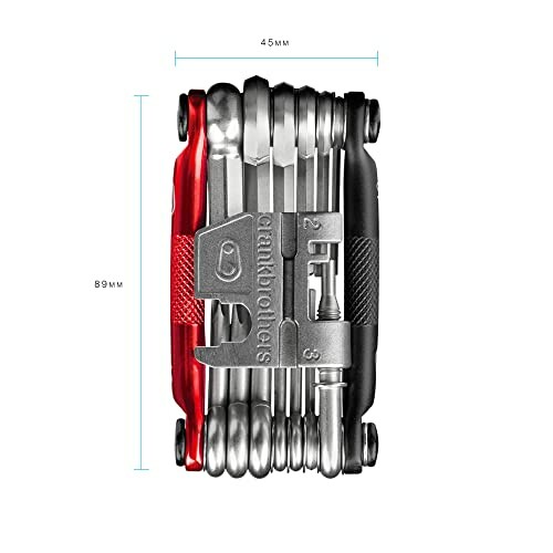 Compact multitool with various tools folded, measurements shown.