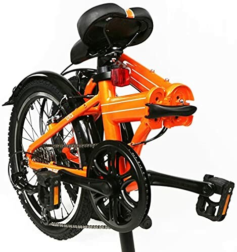 Folded orange bicycle with black seat and pedals.