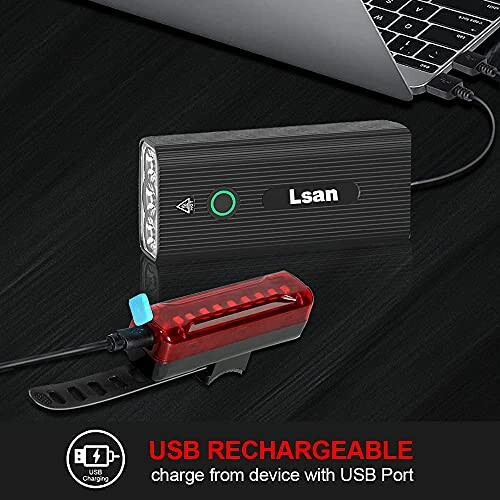 USB rechargeable bike light set with two lights connected to a laptop.