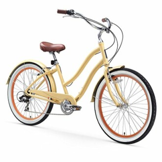 Yellow cruiser bicycle with brown seat and handlebars.